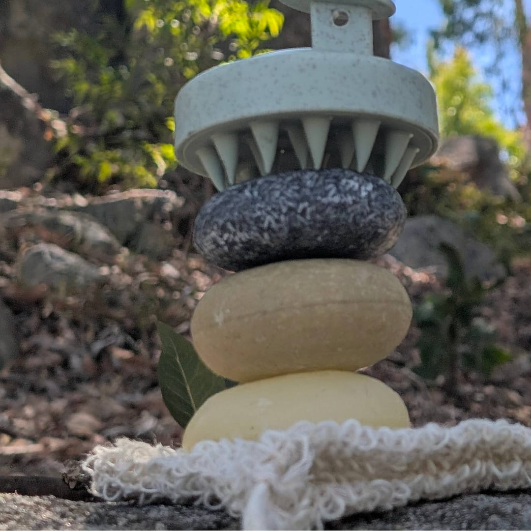 The Ritual Bundle – Eco Shampoo & Conditioner Bars + Scalp Massager & Sisal Soap Bag 3 stacked shampoo conditioner bars with scalp massager eco haircare routine