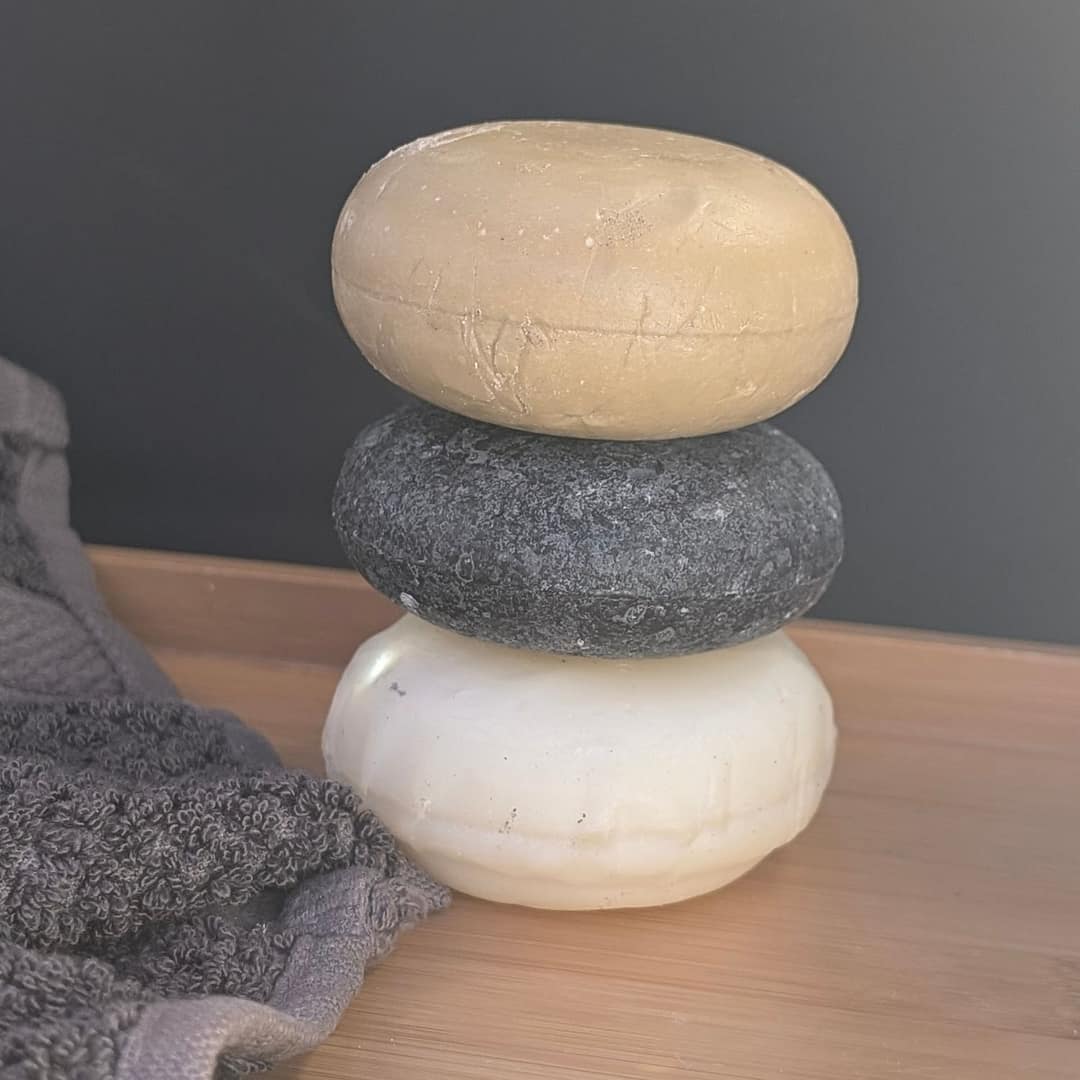 Hydrate & Detox Bar Set – Shea Butter, Charcoal & Argan Oil 2 hydrate and detox shampoo and conditioner bars stacked in natural indoor light